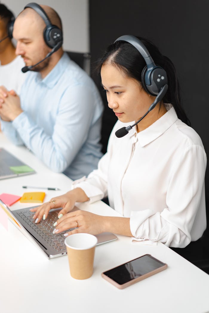 Professionals working in a call center, focusing on customer service and communication.